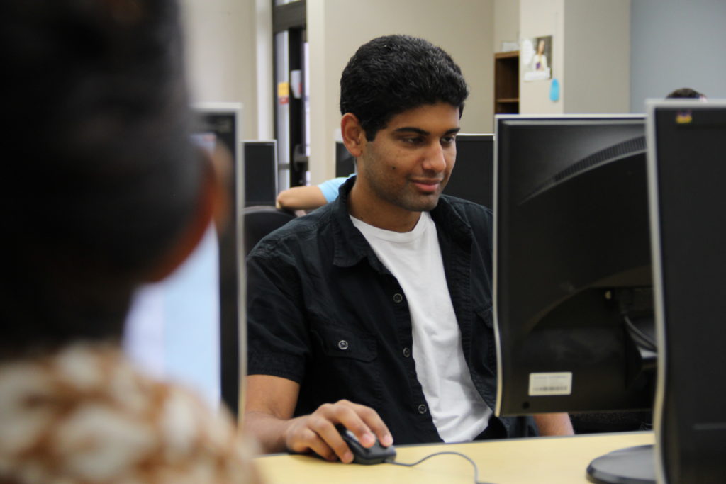 student in college computer center